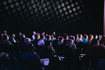 crowd-of-people-sitting-on-chairs-inside-room.jpg crowd of people sitting on chairs inside room